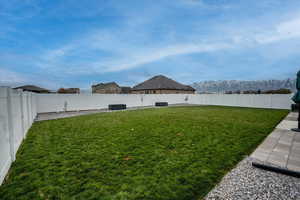 View of yard with a mountain view and central air condition unit