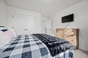 Bedroom with carpet flooring and a closet