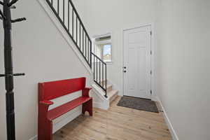 Foyer with light hardwood / wood-style flooring