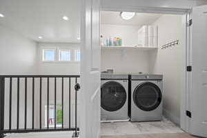 Washroom with separate washer and dryer and a wealth of natural light