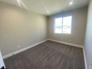 View of carpeted spare room