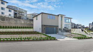 View of front facade featuring a garage