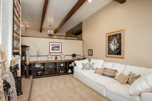 Beautiful bright sitting room with high ceilings and fireplace.