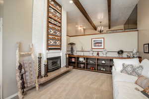 Beautiful bright sitting room with high ceilings and fireplace.