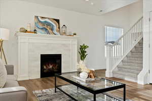 Living room featuring a fireplace and hardwood / wood-style flooring