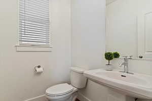 Bathroom featuring toilet and sink