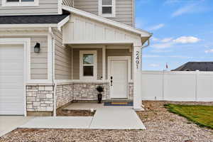 Entrance to property featuring a garage