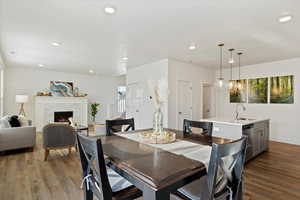 Dining area with light hardwood / wood-style flooring and sink