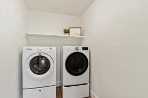 Laundry area with washer and clothes dryer