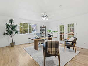 Office featuring french doors, light hardwood flooring, a wealth of natural light, and ceiling fan