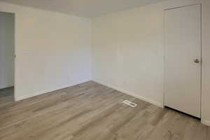 Empty room featuring light hardwood / wood-style floors