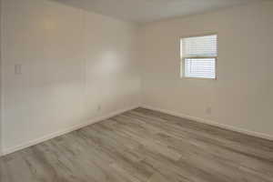 Empty room featuring light hardwood / wood-style floors