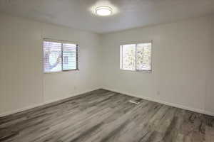 Spare room with wood-type flooring