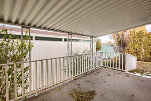 View of patio / terrace featuring a storage unit