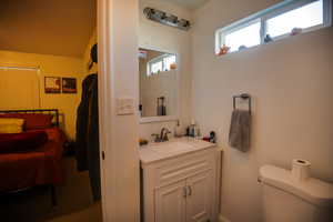 Bathroom featuring vanity and toilet