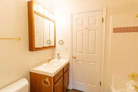 Bathroom featuring vanity and toilet