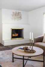 Carpeted living room featuring a fireplace