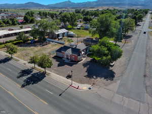 View from above of property with a mountain backdrop