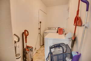 Laundry area featuring independent washer and dryer