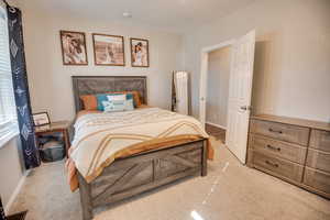 View of carpeted bedroom