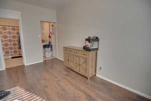 Bedroom featuring dark hardwood / wood-style floors