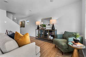 Living room with hardwood / wood-style floors