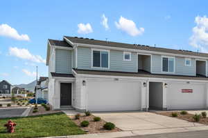 View of front property featuring a garage