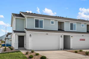 View of property featuring a garage