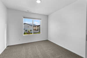 View of carpeted spare room