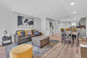 Living room with light hardwood / wood-style flooring