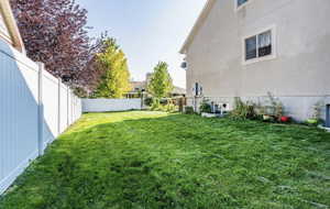 View of yard with a fenced backyard