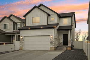 Craftsman-style home featuring a garage