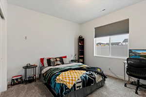 Bedroom featuring carpet floors