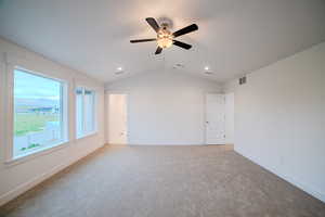 Empty room with ceiling fan, carpet flooring, recessed lighting, and vaulted ceiling
