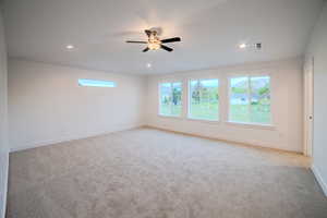 Unfurnished room with baseboards, recessed lighting, ceiling fan, and light colored carpet