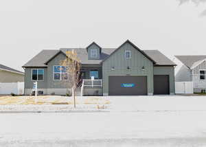 View of front of property featuring a garage