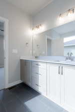 Bathroom featuring tile patterned floors and vanity