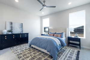 Carpeted bedroom with ceiling fan