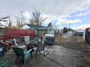 View of patio / terrace featuring a fire pit and grilling area