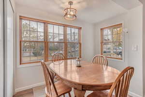 Dining area featuring plenty of natural light and light hardwood / wood-style floors