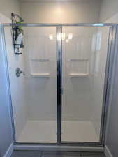 Bathroom with a shower with shower door