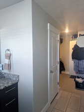 Bathroom with vanity and a textured ceiling