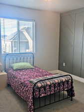 Bedroom featuring carpet flooring and a textured ceiling