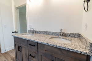 Bathroom featuring hardwood / wood-style floors and vanity