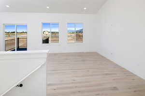 Spare room featuring light wood-type flooring