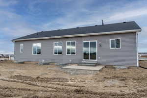 Rear view of property featuring a patio