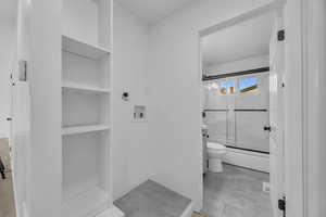 Bathroom featuring tile patterned flooring and toilet