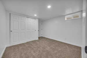 Unfurnished bedroom with carpet flooring and a closet