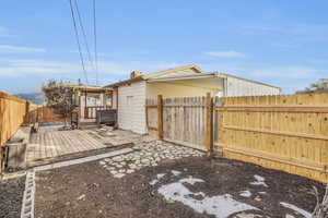 View of yard with a wooden deck