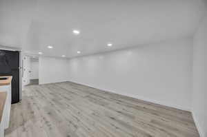 Unfurnished living room with light wood-type flooring